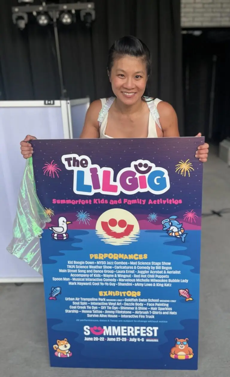 Smiling woman holding The LilGig kids and family lineup poster at Summerfest 2026
